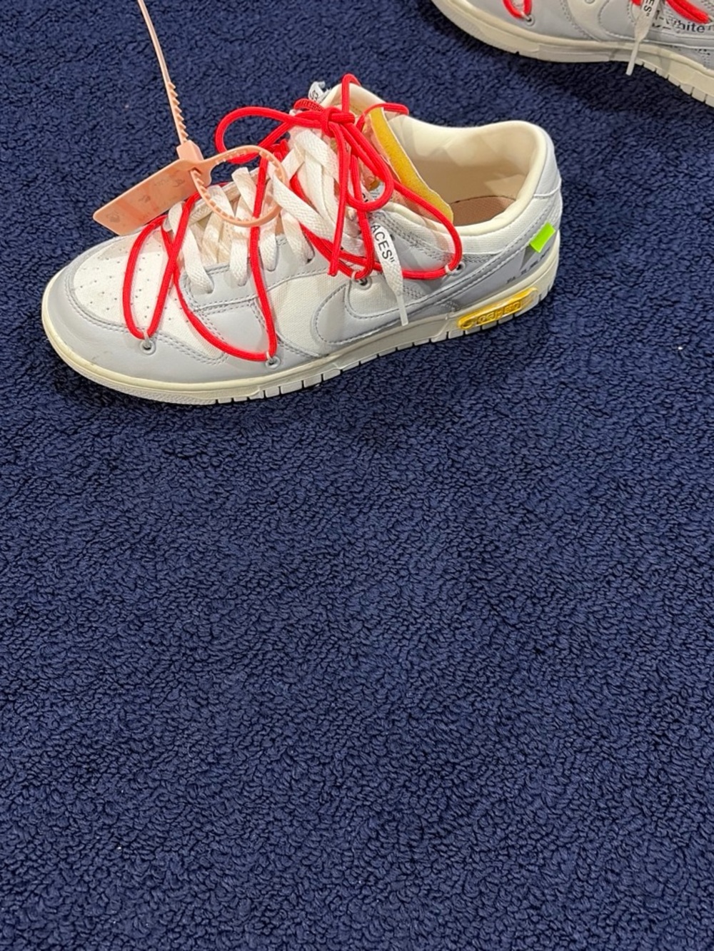 Nike Kids White Sneakers with Red Laces and Yellow Accent